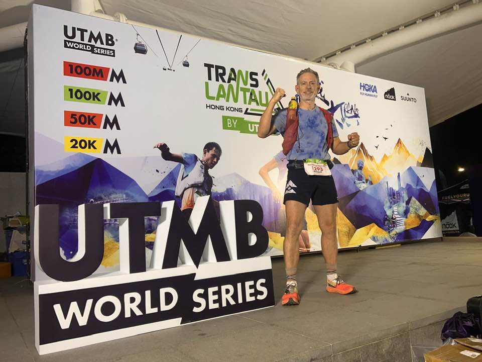 Rich Cowler posing before the UTMB Trans Lantau race wearing bib 1293